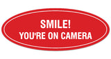 Signs ByLITA Oval Smile You're on Camera Sign - Laser-Engraved Lettering | Durable ABS Plastic | Vibrant Colors | Powerful Foam Tape