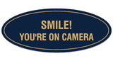 Signs ByLITA Oval Smile You're on Camera Sign - Laser-Engraved Lettering | Durable ABS Plastic | Vibrant Colors | Powerful Foam Tape