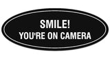 Signs ByLITA Oval Smile You're on Camera Sign - Laser-Engraved Lettering | Durable ABS Plastic | Vibrant Colors | Powerful Foam Tape