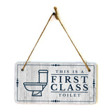 This is a First-Class Toilet 5x10 Hanging Wall or Door Sign | Warm Welcoming Signage For Homes