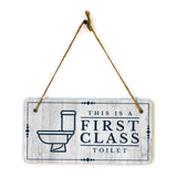 This is a First-Class Toilet 5x10 Hanging Wall or Door Sign | Warm Welcoming Signage For Homes