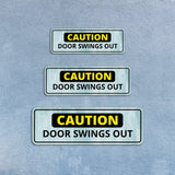 Standard Plus Caution Door Swings Out Wall or Door Sign | Public Spaces Signage
