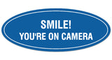 Signs ByLITA Oval Smile You're on Camera Sign - Laser-Engraved Lettering | Durable ABS Plastic | Vibrant Colors | Powerful Foam Tape