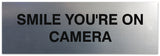 Signs ByLITA Basic Smile you're on camera Sign - Laser-Engraved Lettering | Durable ABS Plastic | Vibrant Colors | Powerful Foam Tape