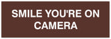 Signs ByLITA Basic Smile you're on camera Sign - Laser-Engraved Lettering | Durable ABS Plastic | Vibrant Colors | Powerful Foam Tape