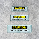 Standard Plus Caution Door Swings Out Wall or Door Sign | Public Spaces Signage