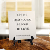 Let All That You Do Be Done In Love. Corinthians 16:14 5"x 5" Square Table Sign With Acrylic Easel | Religious Bible Quotes